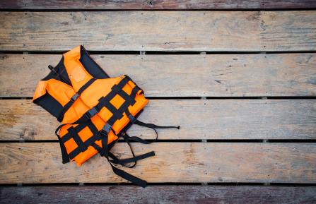 orange life jacket on dock